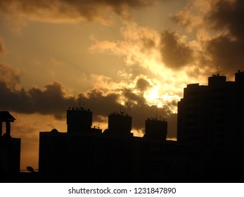 sunset behind building