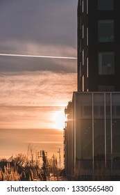Sunset behind a building