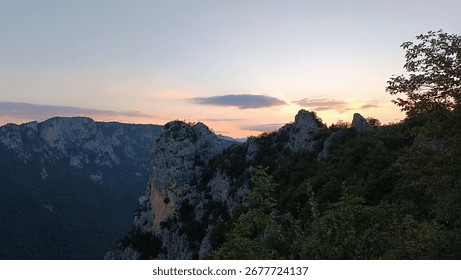 Sunset behind the cliffs and mountains