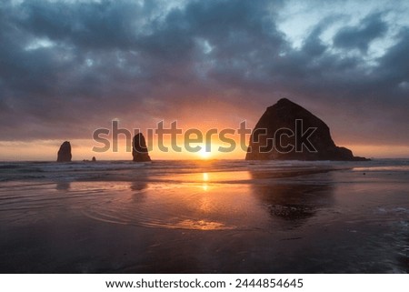Sunset behind Haystack Rock at Cannon Beach on the Pacific Northwest coast, Oregon, United States of America, North America