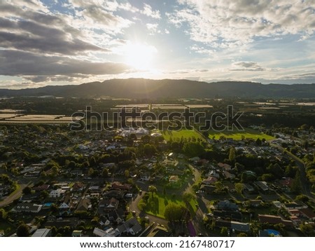 Sunset behind the mountains of Te Puke city. Bay of Plenty Region, New Zealand