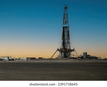 Sunset behind the oil rig in the Saudi Arabia 