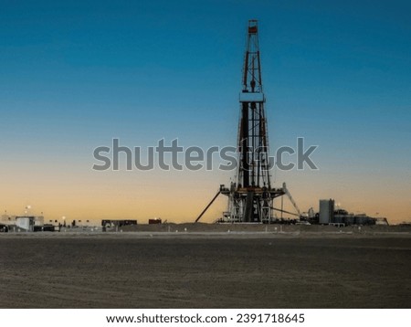 Sunset behind the oil rig in the Saudi Arabia 