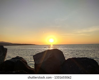 sunset behind the rocks