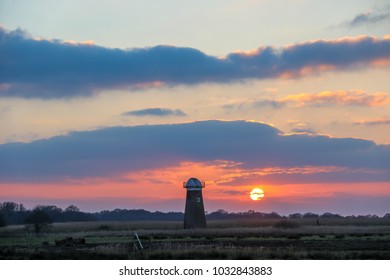 Sunset behind windmill