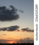 Sunset beneath the clouds .