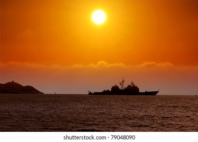Sunset in Benidorm with battleship