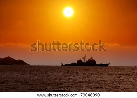 Sunset in Benidorm with battleship