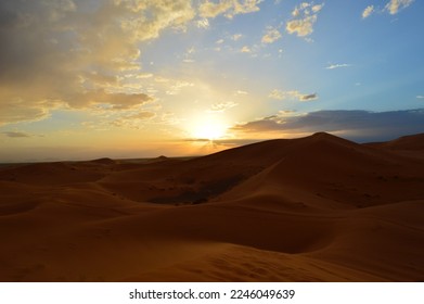Sunset between mountains in the desert. - Shutterstock ID 2246049639