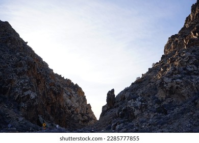 sunset between two mountains in the desert