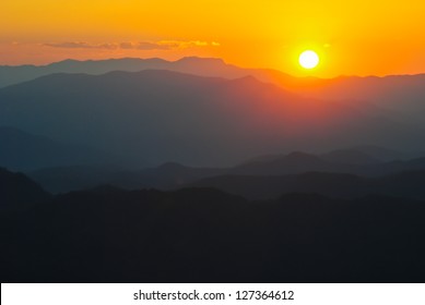 sunset and blue mountain at Phuping Palace in Chiang Mai, Thailand - Powered by Shutterstock