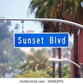 Sunset Blvd Street Sign With Palm Trees In Hollywood, California.