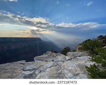 Sunset breaking through the clouds over the Grand Canyon's South Rim