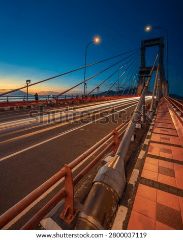 a sunset at the bridge