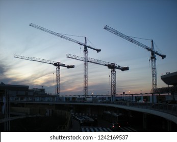 Sunset In Budapest. Crane Parade At The Airport