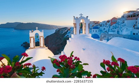 sunset by the ocean of Oia Santorini Greece, a traditional Greek village in Santorini with whitewashed churches and blue domes - Shutterstock ID 2281637155