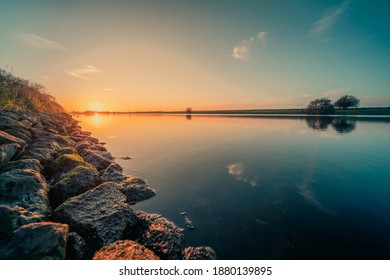 The Sunset At The Canal Through Walcheren In The Netherlands