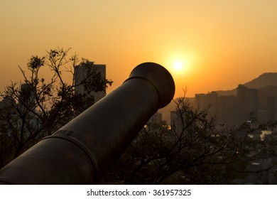 Sunset and Canon at Fortaleza do Monte in Macau, China.