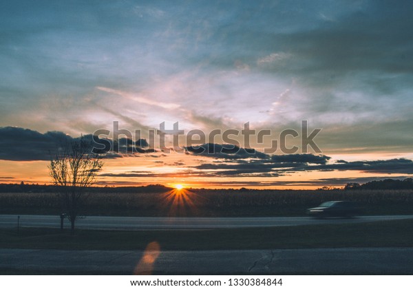 Sunset with car flying\
by