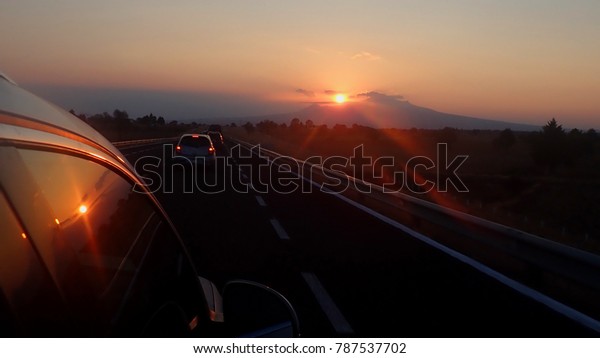 Sunset from the car in the\
road