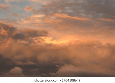 The sunset cast a beautiful, dramatic glow across the brooding, dark clouds.