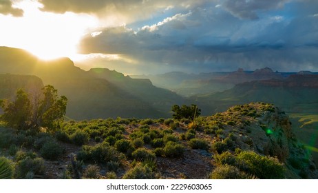 Sunset casts final beams of light on the Grand Canyon as a storm looms