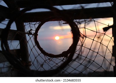 sunset caught in a lobster trap