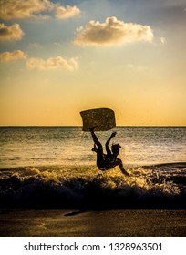 Sunset Child Surfer Wipeout 