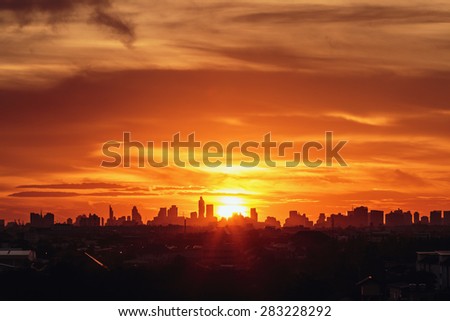 Sunset at city of Bangkok with  building silhouette