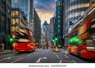 Sunset at the City of London, England, with traffic light trails and illuminated skyscrapers