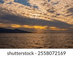 Sunset and city view from the city ferry. Izmir city and Izmir gulf. Port city in the Aegean Sea.