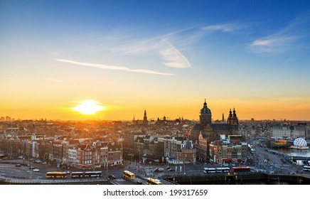 Sunset cityscape in winter of the skyline of Amsterdam, the Netherlands. 