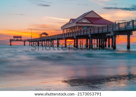 Sunset. Clearwater Beach Florida. Pier 60 Clearwater Beach FL. Beautiful seascape. Fishing pier. Summer vacations. Ocean or Gulf of Mexico. Florida paradise. Tropical nature. Good for travel agency.
