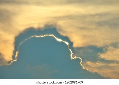 Sunset cloud sky with sunlight behind. - Shutterstock ID 1202991709