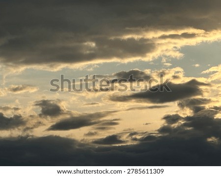 Sunset clouds creating atmospheric evening sky scene and natural outdoor weather environment
