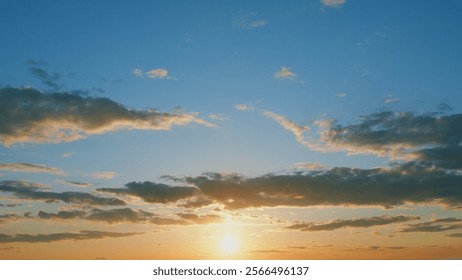 Sunset with clouds in motion. Summer sky at sunset with clouds. Timelapse.