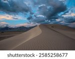 Sunset clouds over big dunes recreation area in Nevada 