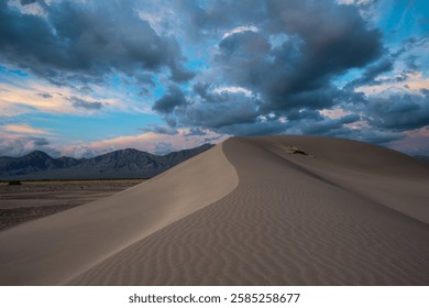 Sunset clouds over big dunes recreation area in Nevada 