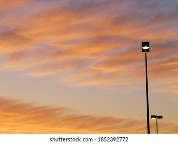 Sunset Clouds In Strip Mall Parking Lot