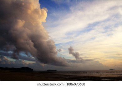 Sunset clouds that seem to touch the sea