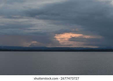 sunset cloudscape over a lake