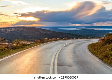Sunset Coastal Highway - An Autumn sunset view of winding Cadillac Summit Road near top of Cadillac Mountain in Acadia National Park, Maine, USA. Note: main focus is on the winding road.