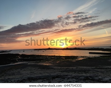 Sunset in Cobo bay on channel island of Guernsey in England