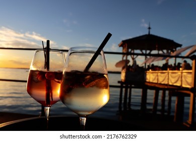 sunset coctail at lake of constance. during summertime at bodensee the drinks taste even better with a warm breeze in the afternoon and sunset. - Shutterstock ID 2176762329