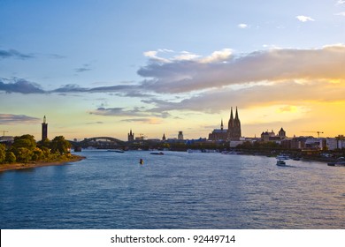 Sunset In Cologne With Dome And River Rhine