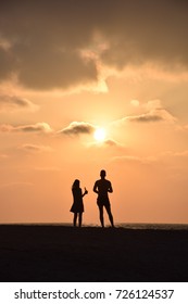 Sunset couple - Shutterstock ID 726124537