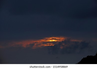 Sunset covered by dark cloud.