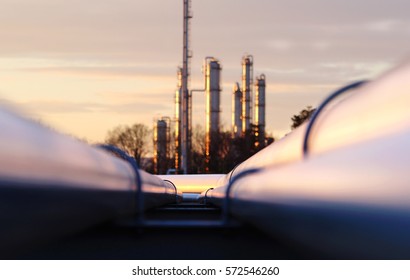 Sunset At Crude Oil Refinery With Pipeline Network