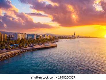 Sunset in Cyprus. View of Limassol coast at sunset. View of Limassol from the top. Promenade of the Mediterranean sea. Parasailing over the Mediterranean. Parachuting. Evening landscape of Cyprus.