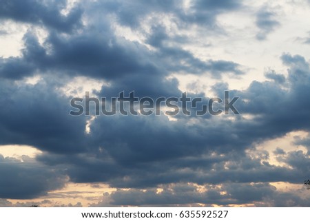 Sunset and dark heavy clouds. Gray cloud before rain.